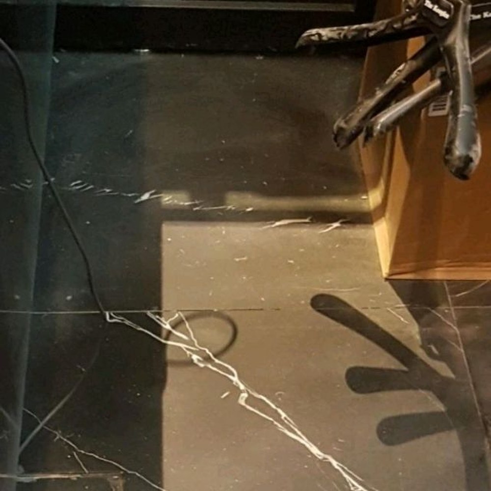 Black floor tile repair — after
