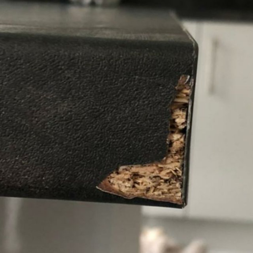 Black worktop edge repair — before