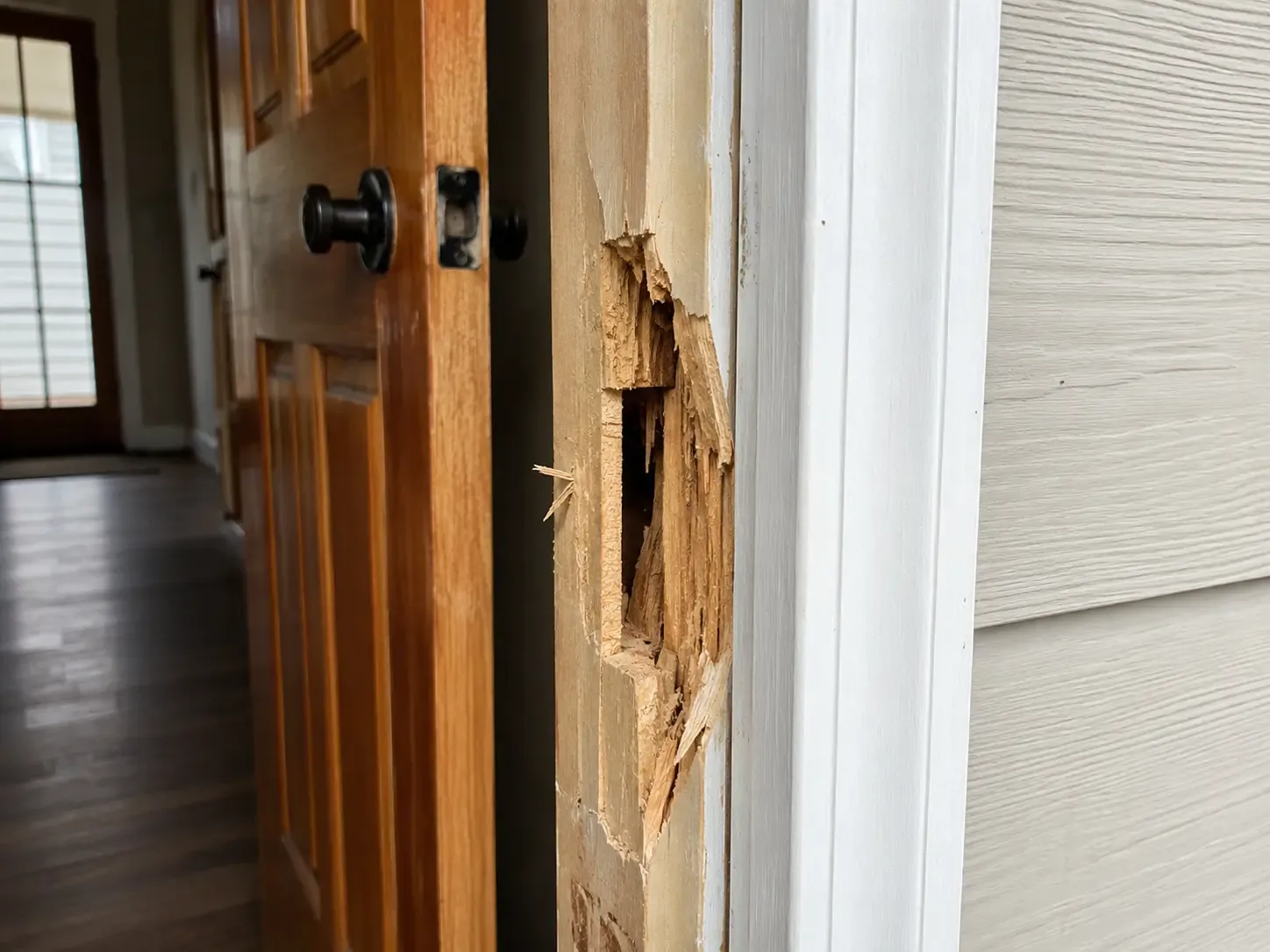 Damaged timber door frame requiring repair