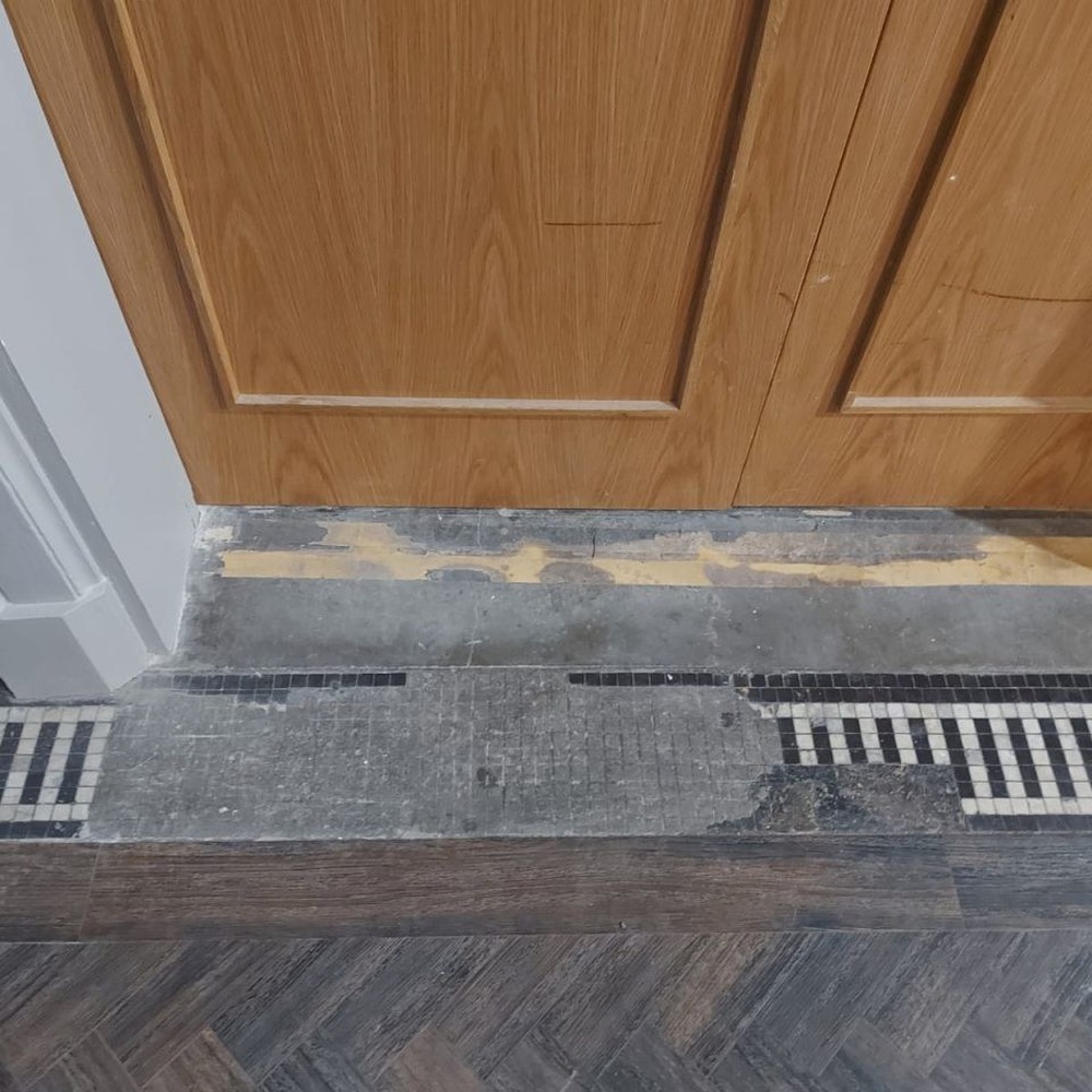 Threshold tile restoration — before